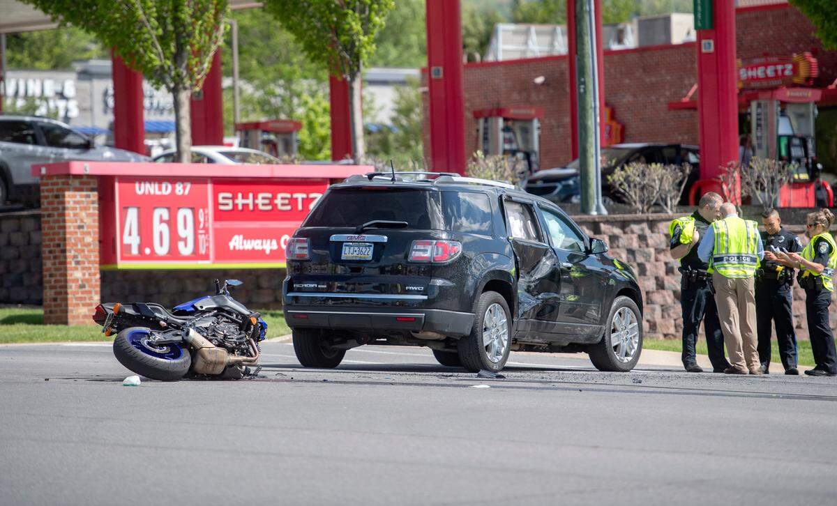 Police at the scene of a crash between a vehicle and a motorcycle on South Atherton Street at the intersection of West Branch Road on Tuesday, May 17, 2022.