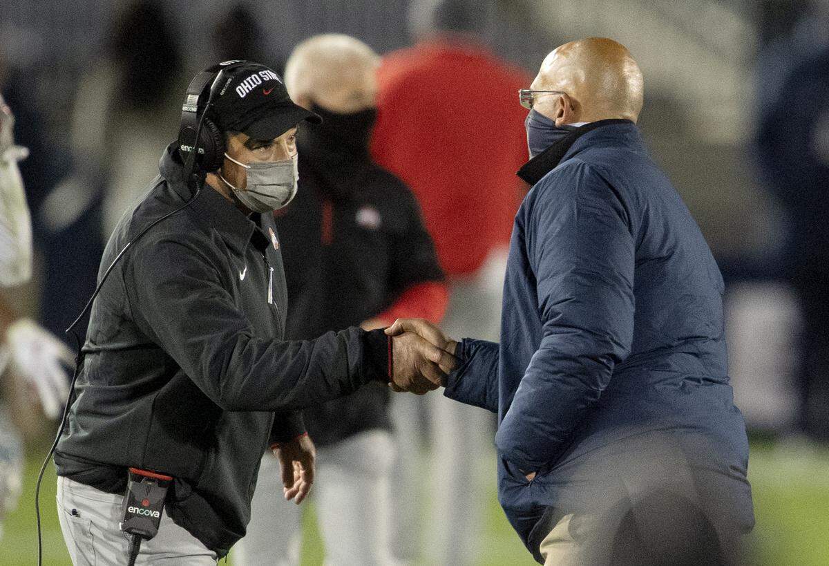 Ohio State’s Ryan Day and Penn State’s James Franklin shake hands after the game on Saturday, Oct. 31, 2020 at Beaver Stadium.