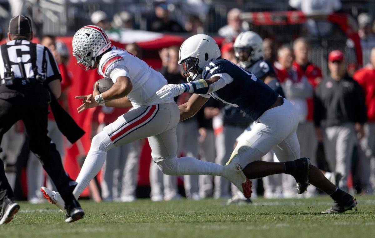 Penn State linebacker Abdul Carter reaches for Ohio State’s C.J. Stroud during the game on Saturday, Oct. 29, 2022.