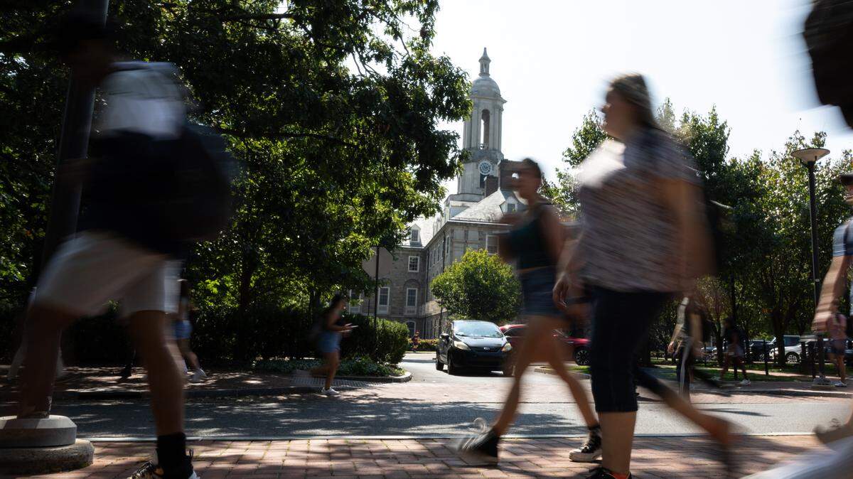 Penn State students walk through campus on the first day of classes on Monday, Aug. 26, 2024.
