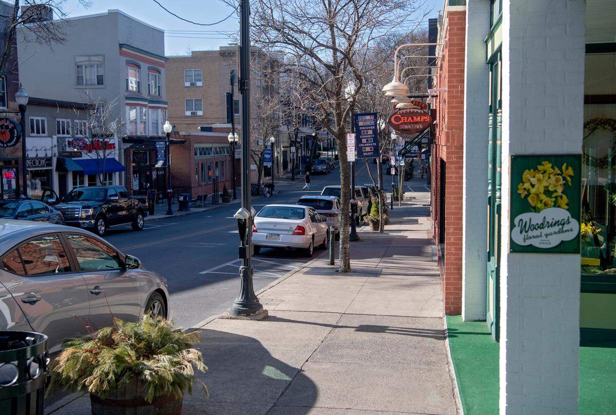 There was less foot traffic along Allen Street in downtown State College on Friday, with businesses taking precautions to prevent the spread of the new coronavirus, and Penn State students discouraged from returning to campus.