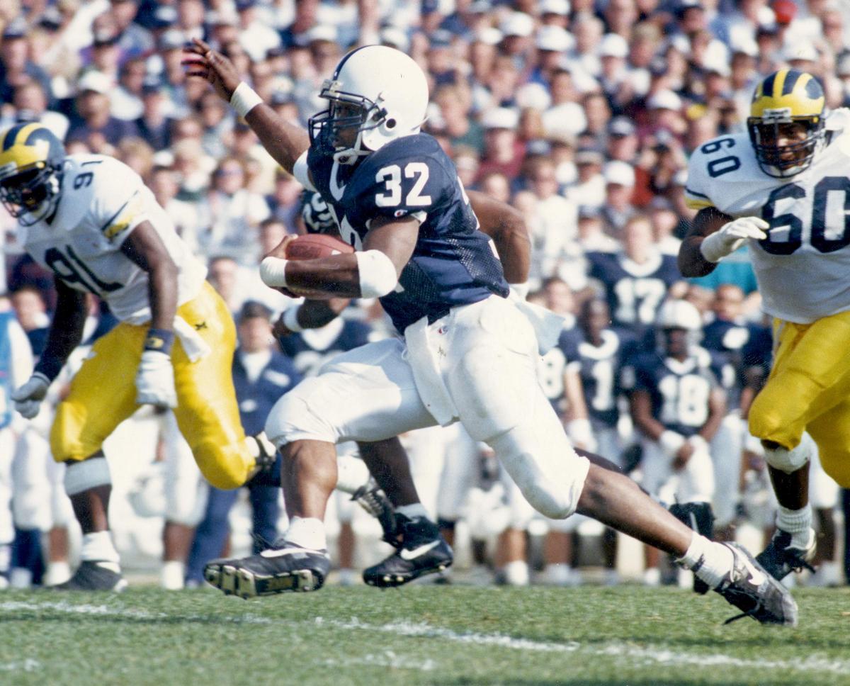 Penn State's Ki-Jana Carter runs away from Michigan defenders during a game in October of 1993. CDT Photo Pat Little.