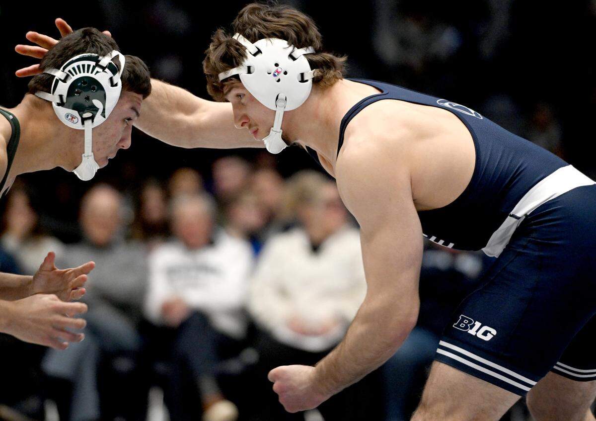 Penn State’s Levi Haines reaches for Michigan State’s Ceasar Garza in the 174 lb bout of the match on Friday, Jan. 10, 2025 in Rec Hall. Haines won by fall.