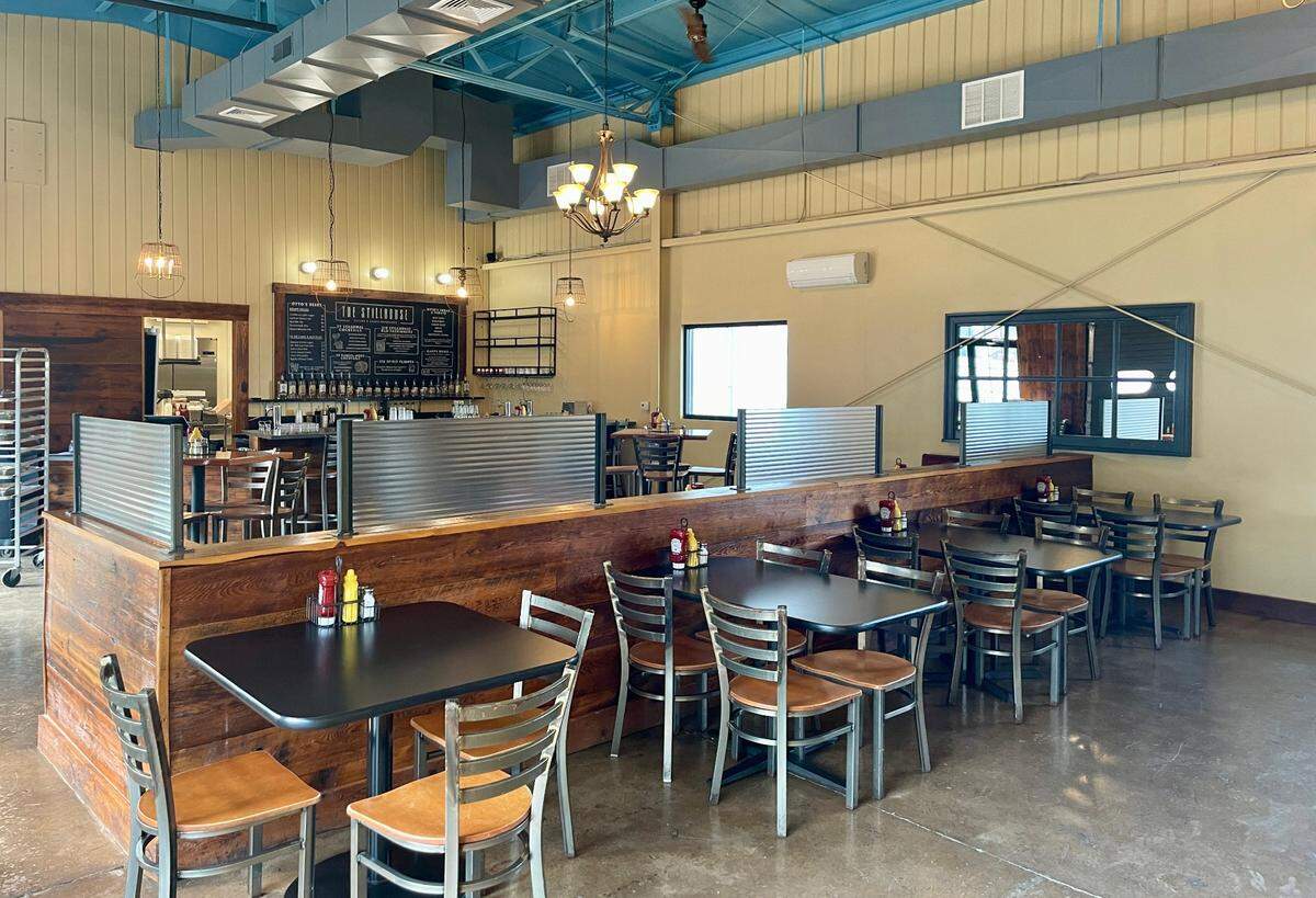 Tall ceilings help provide a spacious feel in the restaurant’s main dining room.