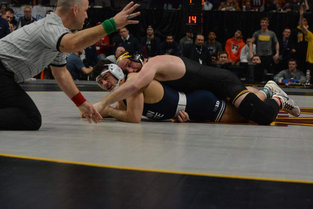 Iowa’s Alex Marinelli scores four near-fall points on Penn State’s Vincenzo Joseph in their 165-pound final bout of the Big Ten Championships on Sunday. Marinelli topped Joseph 9-3 as Joseph still has yet to win a Big Ten crown.