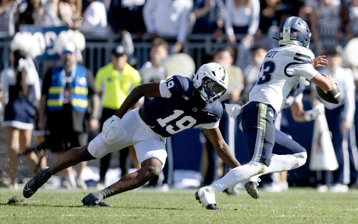 Penn State defensive end Chaz Coleman pressures Nevada quarterback Chubba Purdy during the game on Saturday, Aug. 30, 2025 at Beaver Stadium.
