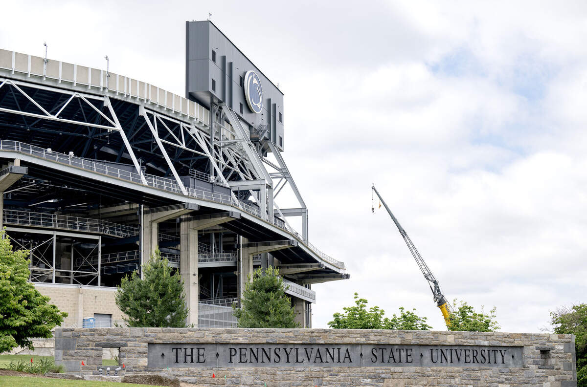 Construction continues at Beaver Stadium as seen from Park Avenue by the Pennsylvania State University sign on Monday, June 8, 2026.