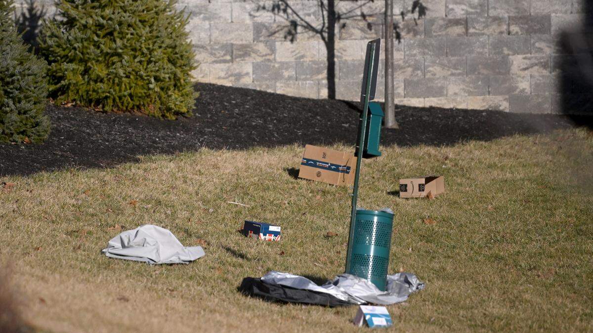 Trash gathers around a receptacle last month at The Yards at Old State, which was issued a notice of violation by the Centre Regional Planning Agency on Feb. 14.