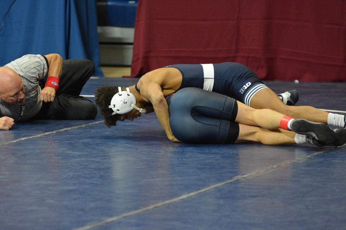 Penn State’s Roman Bravo-Young, top, closes in on a pin of the University of Pennsylvania’s Jon Guevara in their 133-pound quarterfinal match during the Keystone Classic on Sunday. Bravo-Young ended up pinning Guevara in 38 seconds to begin his first college tournament.
