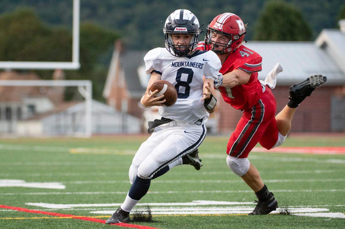 Philipsburg-Osceola’s Ben Gustkey breaks a tackle from Bellefonte’s Nolan Weaver during a high school football game between Bellefonte Area High School and Philipsburg-Osceola High School on Friday, Sept. 3, 2021 in Bellefonte, Pa.