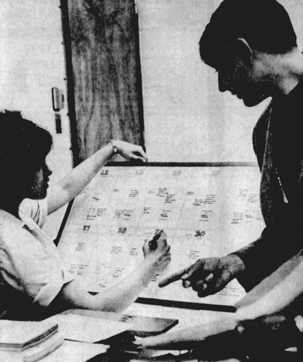 Public relations director Peter Shapiro, right, calls off events in the master calendar for the first-ever Central Pennsylvania Festival of the Arts to Melissa Pohland, secretary in Penn State’s theater arts department.