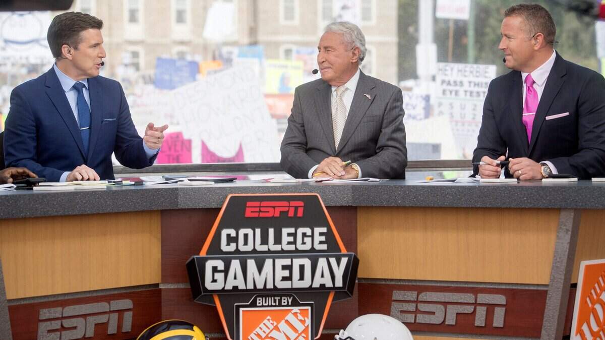 College GameDay’s Rece Davis, Lee Corso and Kirk Herbsteit talk during the broadcast outside of Old Main on Saturday, October 21, 2017. GameDay will be in Lawrence for TCU’s matchup with Kansas.