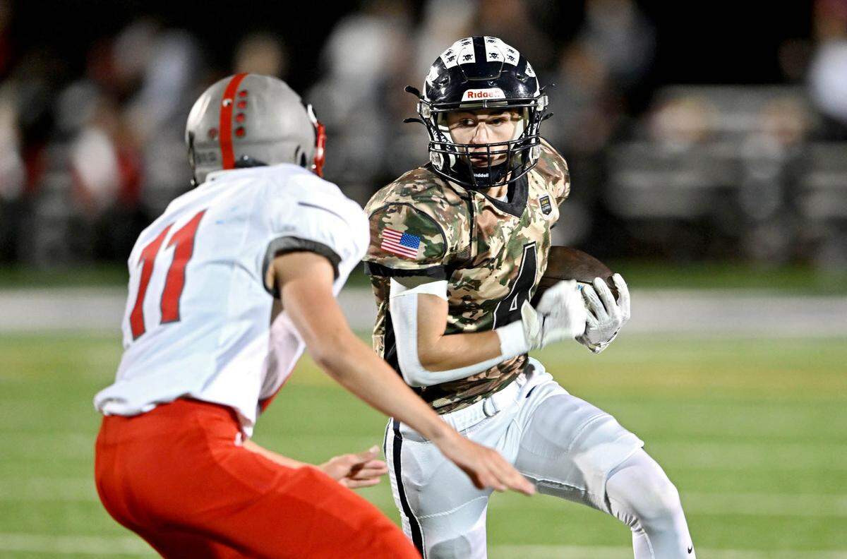 Philipsburg-Osceola’s Sam McDonald cuts down the field with the ball from a Westmont Hilltop defender during the game on Friday, Oct. 11, 2024.