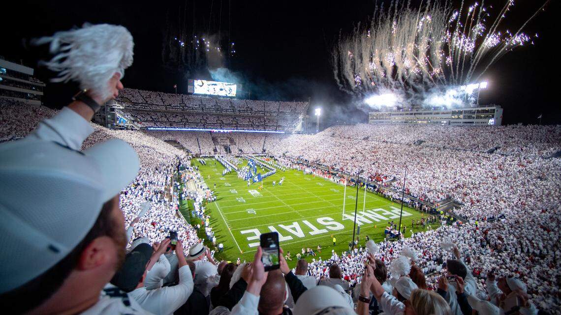 Penn State fans cheer as the football team runs onto the field for the White Out game against Ohio State on Saturday, Sept. 29, 2018 at Beaver Stadium. 