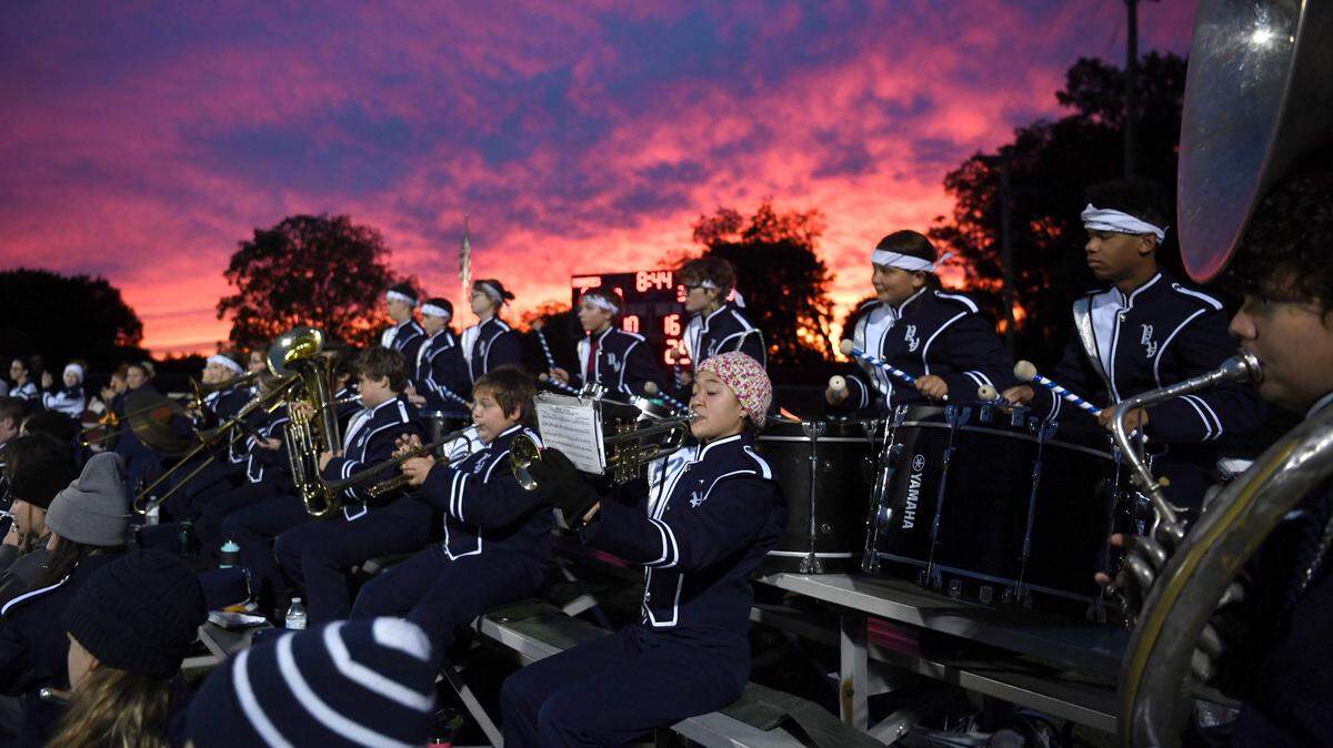 A colorful sunset as the Penns Valley Area marching band plays during the Philipsburg-Osceola football game against Penns Valley on Friday, Sept. 30, 2022.