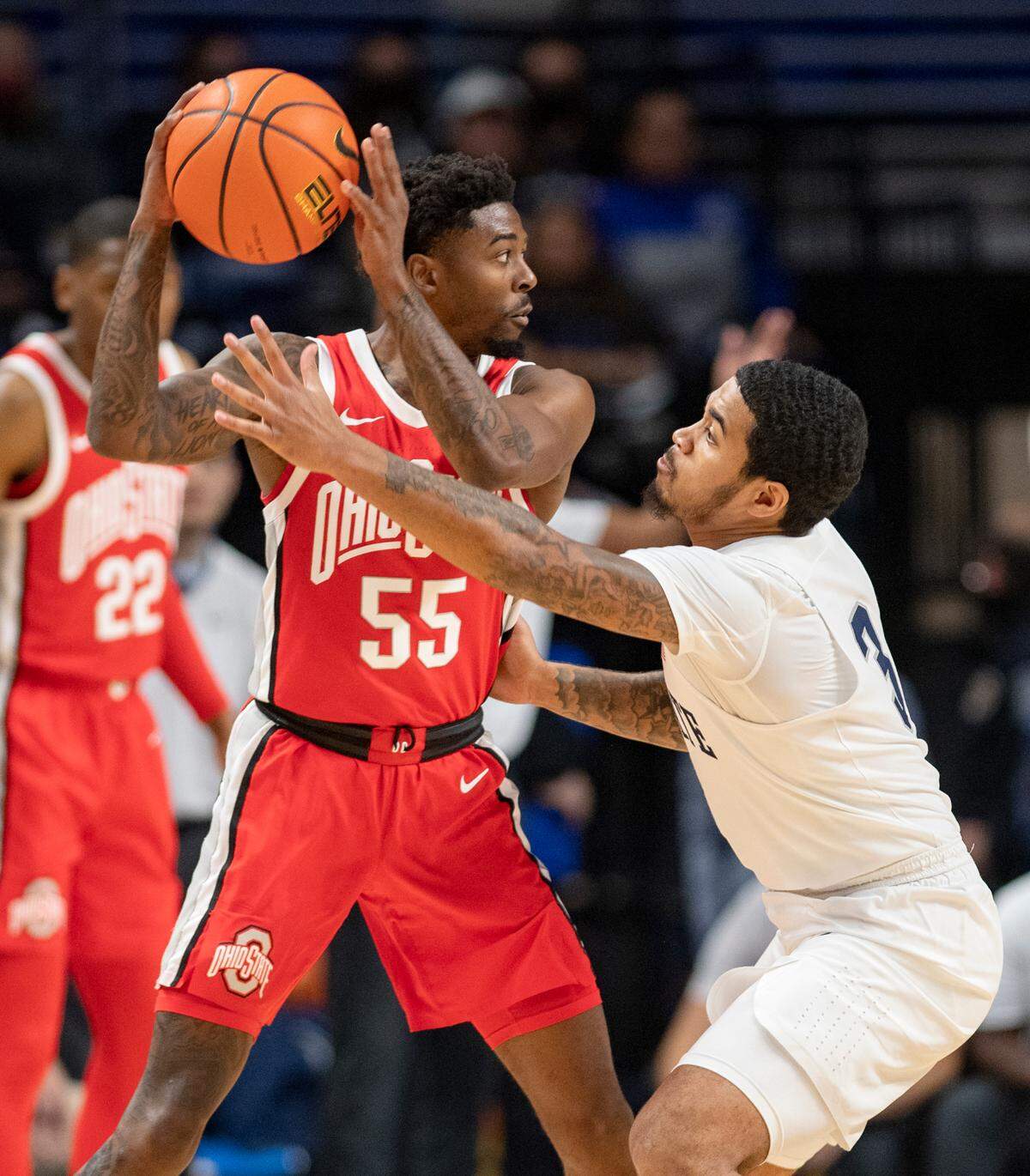 Ohio StateÕs Jamari Wheeler looks for an open teammate around Penn State’s Sam Sessoms during the game on Sunday, Dec. 5, 2021.