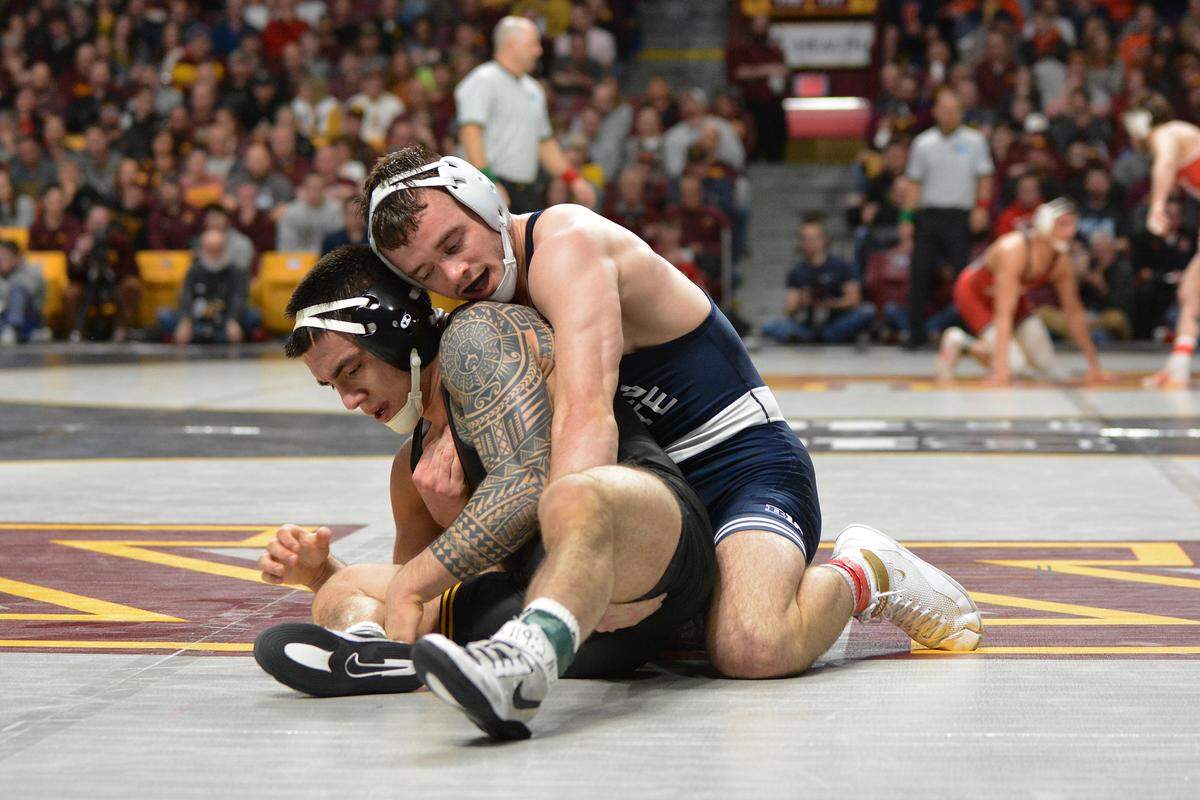 Penn State’s Brady Berge scores the winning takedown on Iowa’s Pat Lugo in their 149-pound quarterfinals match of the Big Ten Championships. Berge beat Lugo 4-2 in sudden victory.