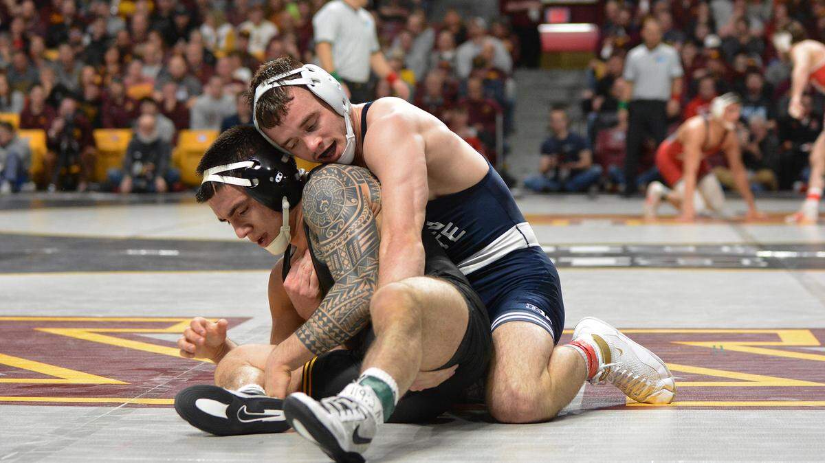 Penn State’s Brady Berge scores the winning takedown on Iowa’s Pat Lugo in their 149-pound quarterfinals match of the Big Ten Championships. Berge beat Lugo 4-2 in sudden victory.