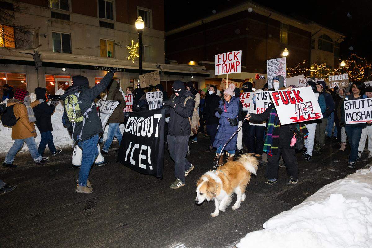 Anti-ICE protesters march through downtown State College on Monday.