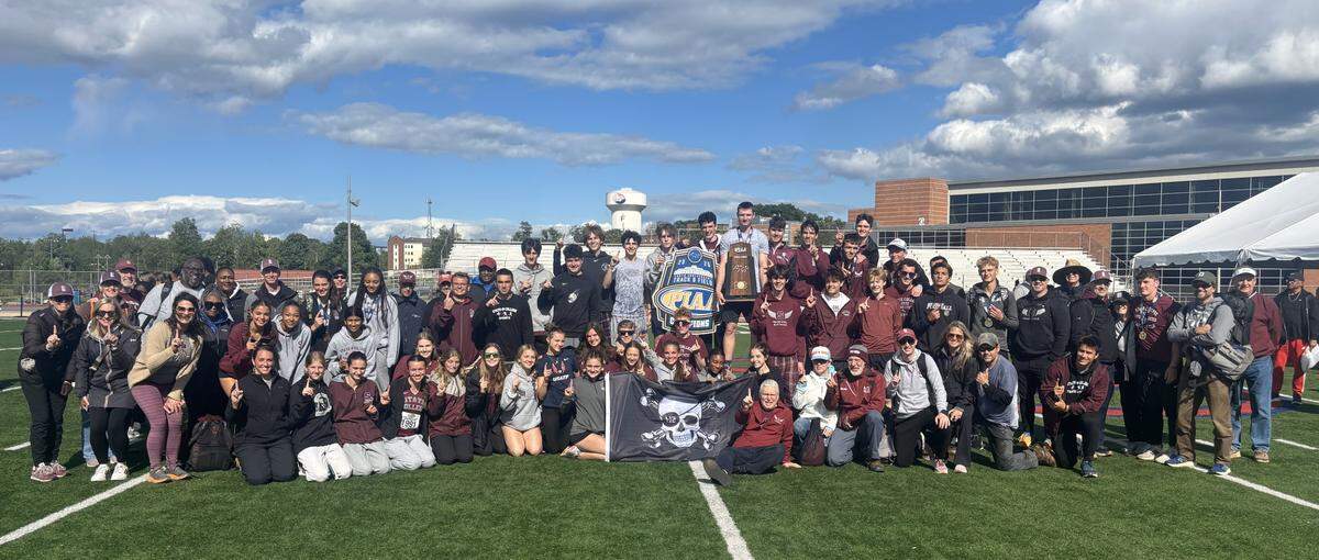 State College student-athletes, coaches, supporters and more pose for photos Saturday after the boys team won the Class 3A state championship at the 2025 PIAA Track and Field Championships at Shippensburg.