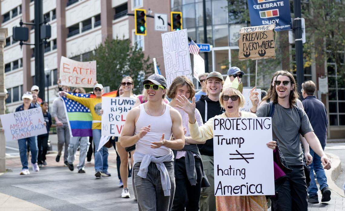 Protesters marched along Fraser Street as part of the No Kings anti-Trump rally on Saturday, Oct. 18, 2025. 