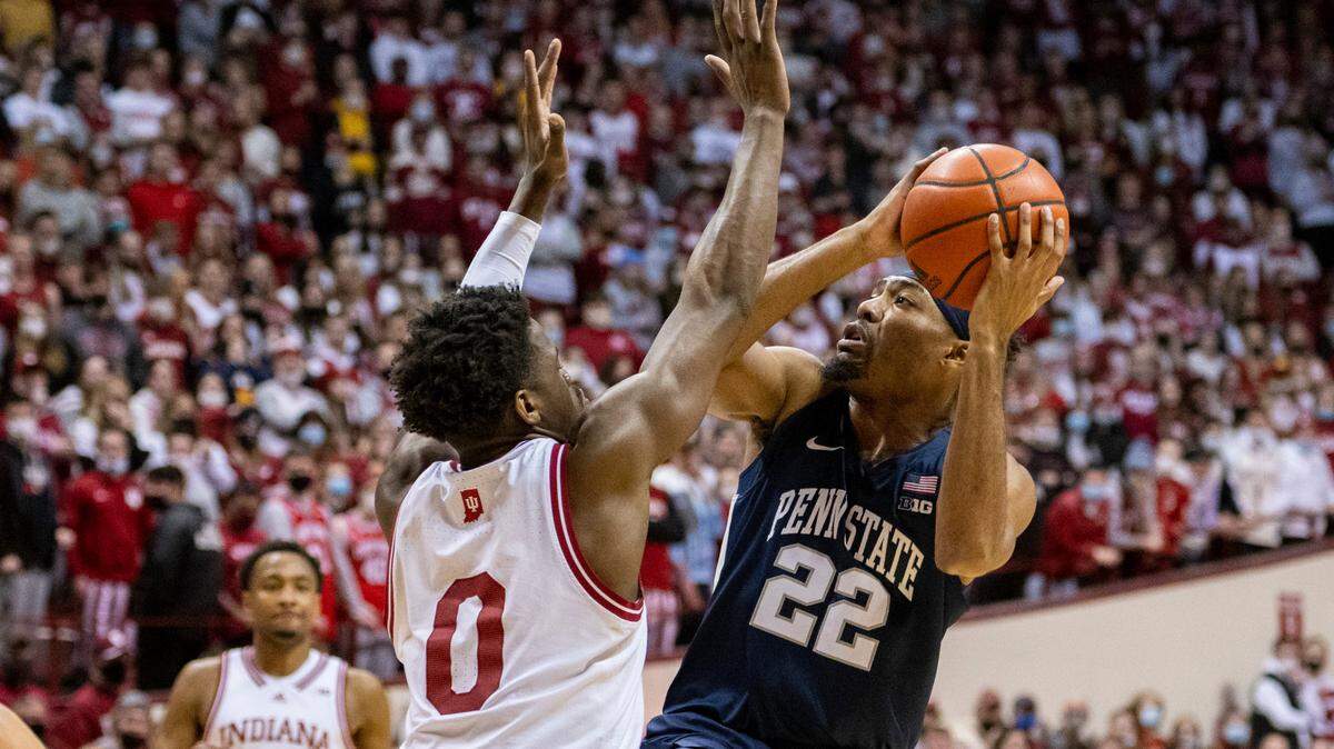 Indiana guard Xavier Johnson (0) defends as Penn State guard Jalen Pickett (22) shoots during the first half of Wednesday’s game in Bloomington, Ind. The Hoosiers coasted to a 74-57 victory.
