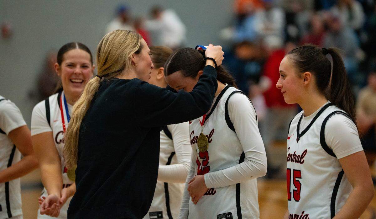 Central Cambria sophomore Paige Alexander accepts her championship medal from her coach after the District 6 Class 3A girls basketball championship game against Cambria Heights at Mount Aloysius in Cambria County, Pa., on Friday, Feb. 27, 2026. Central Cambria defeated Cambria Heights 55-45.
