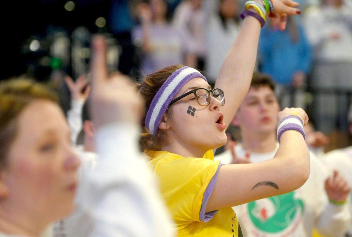 Morgan McCarthy sings along with the line dance during the Penn State IFC/Panhellenic Dance Marathon on Friday, Feb. 16, 2024 at the Bryce Jordan Center. The line dance is performed once an hour through the 46 hours.