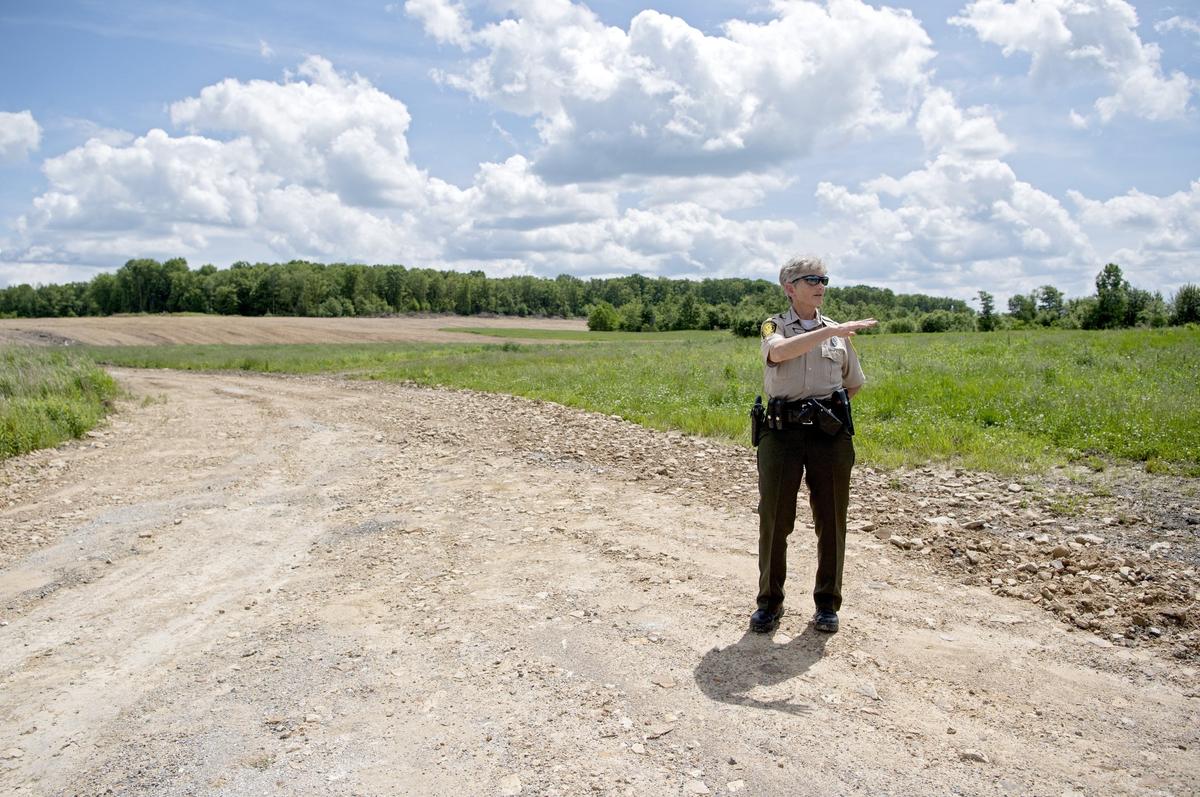 Pennsylvania Game Commission Northcentral Region land management supervisor Colleen Shannon talks about a section of land that was mined for coal and now has been reclaimed on the State Game Lands 100 on Thursday, June 6, 2019.