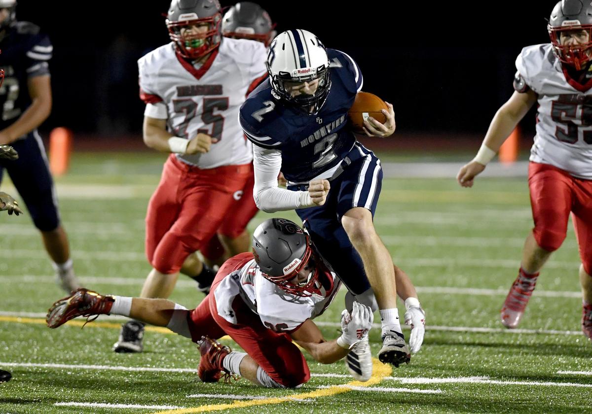 Central defenders try to stop Philipsburg-Osceola’s Jeremy Whitehead during the game on Friday, Sept. 27, 2019.