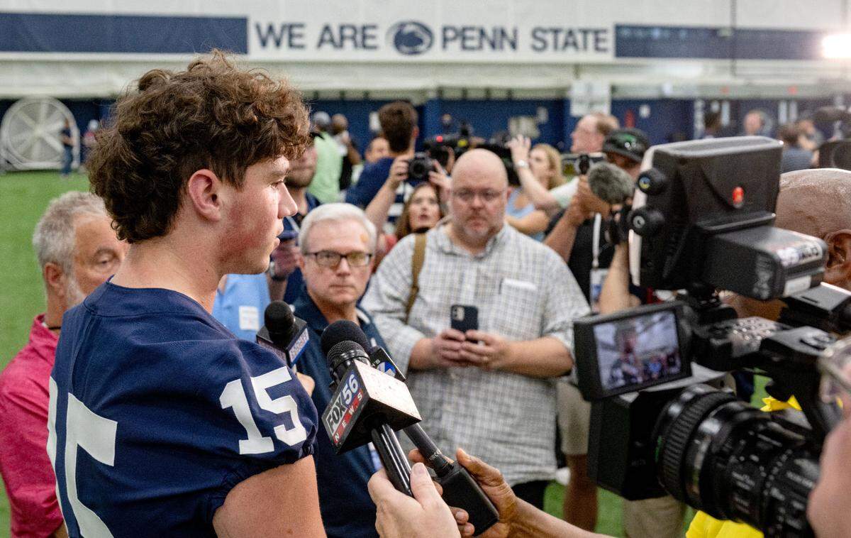 Reporters swarm Penn State quarterback Drew Allar during media day on Saturday, Aug. 3, 2024.