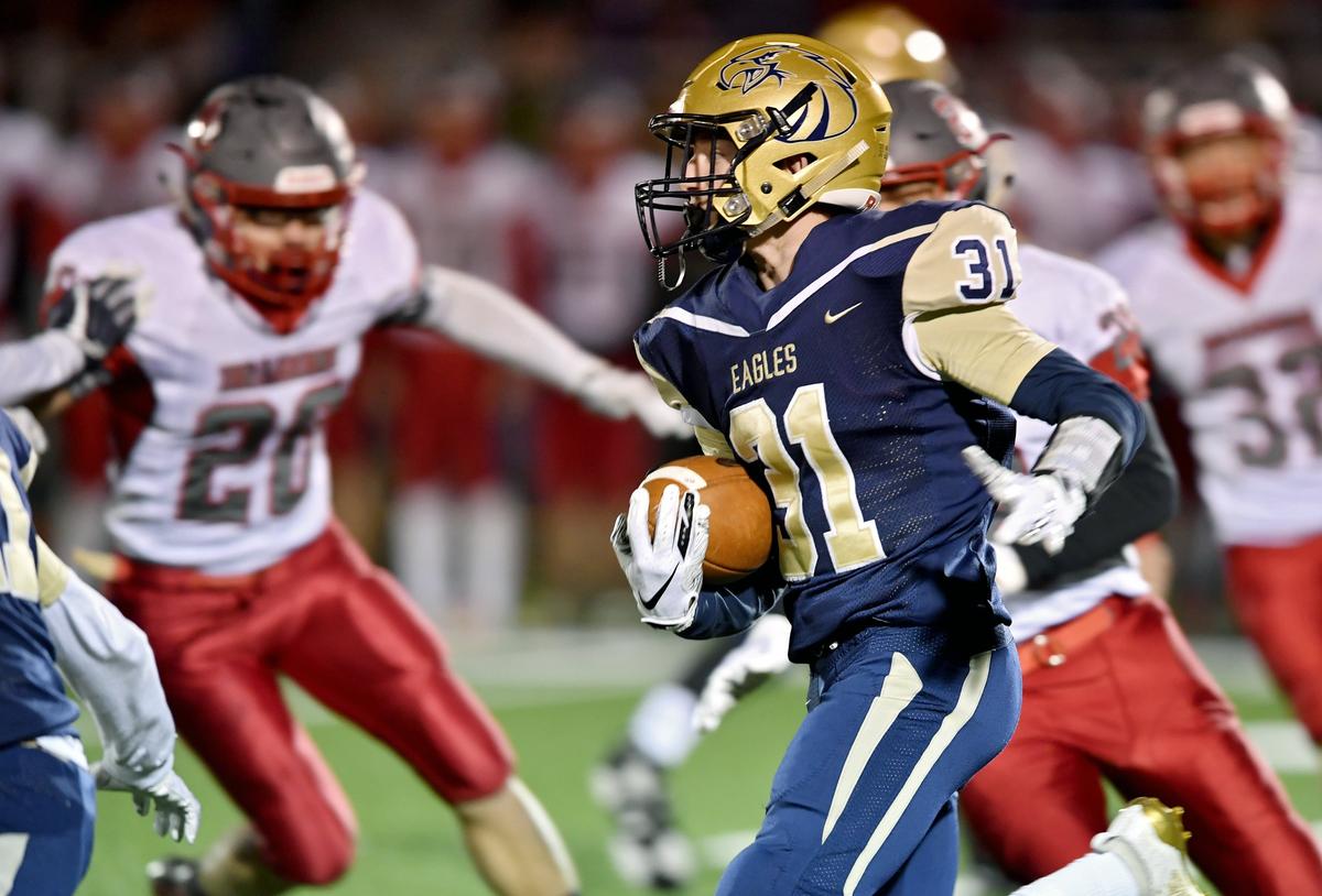 Bald Eagle Area’s Hayden Vaughn runs down the field with the ball from Central defenders during the District 6 playoff game on Friday, Nov. 1, 2019.