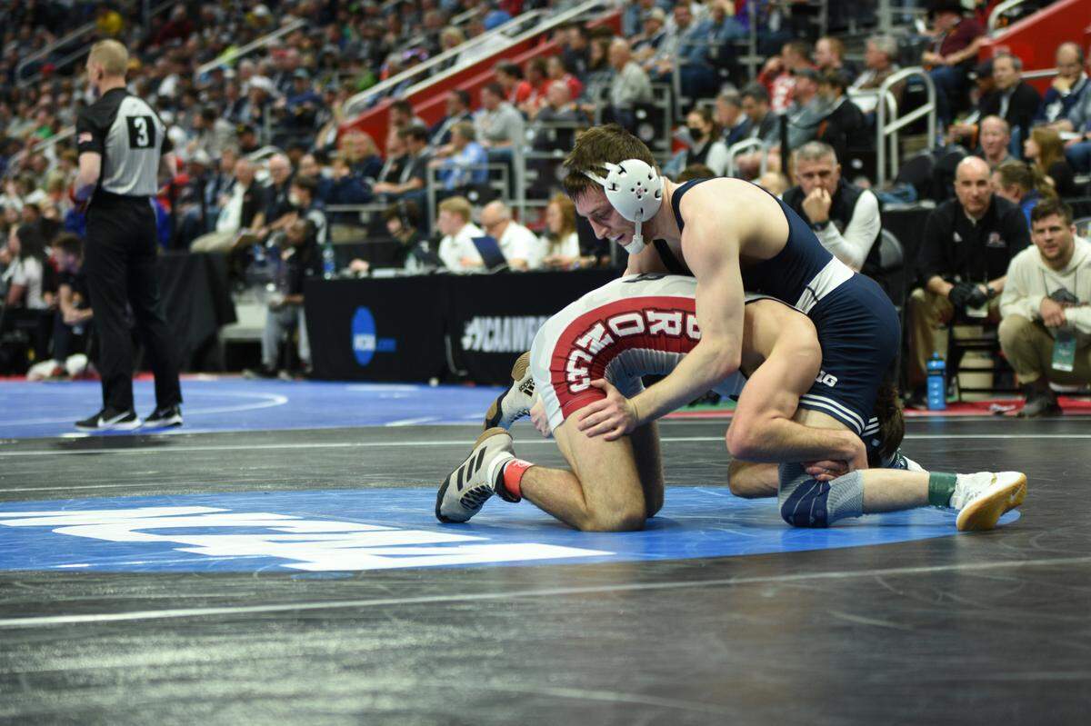 Penn State’s Nick Lee fights off a shot attempt from Rider’s Quinn Kinner in their 141-pound second round match of the NCAA Championships on Thursday, March 17, 2022 at Little Caesars Arena in Detroit. Lee topped Kinner, 9-2.