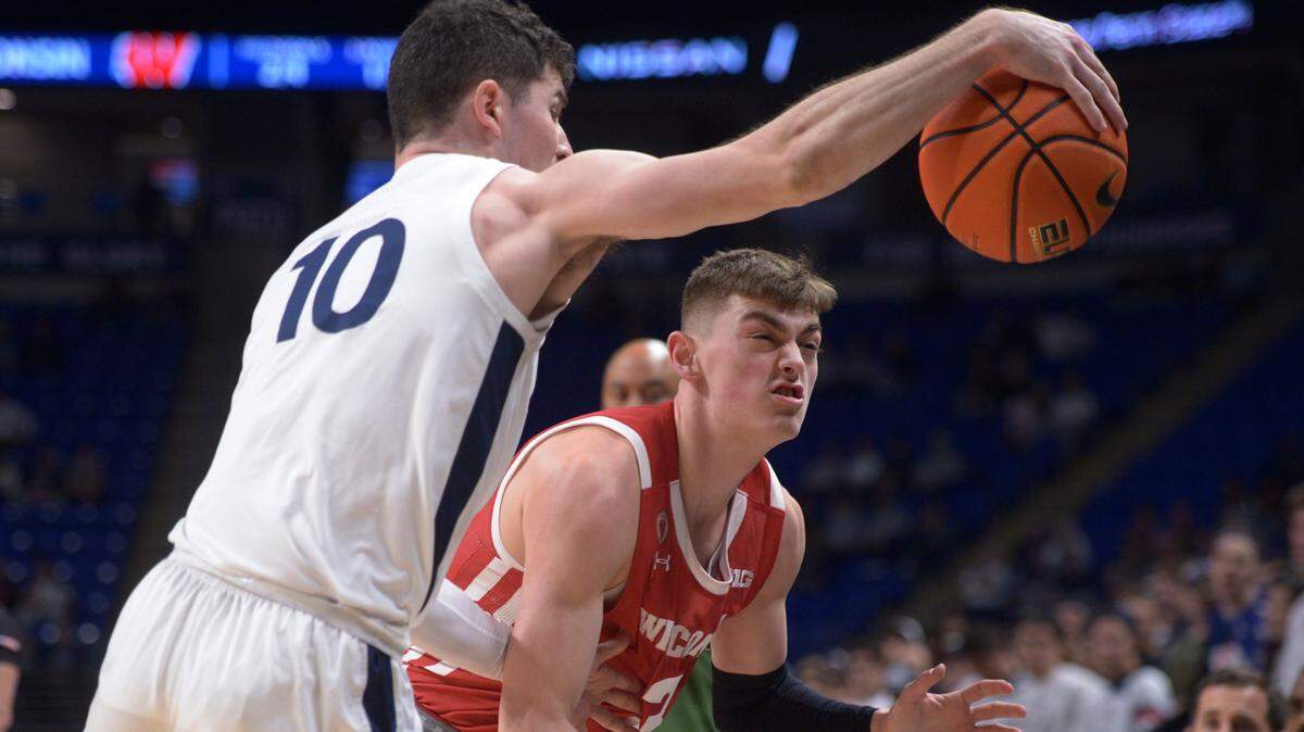 Penn State’s Andrew Funk (10) attempts to bounce an out of bounds ball off Wisconsin’s Connor Essegian (3) during the first half of Wednesday’s game.