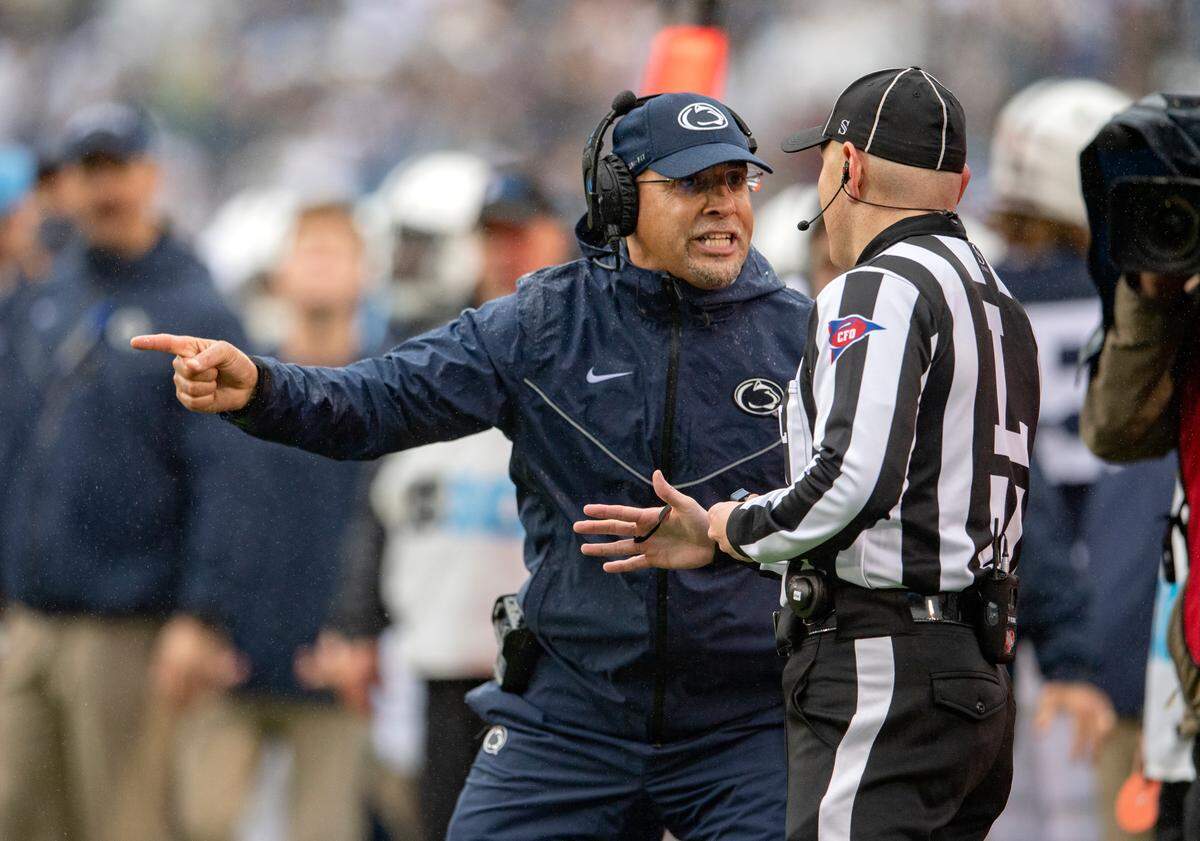 Penn State football coach James Franklin argues with a referee about a call in the first half of the game against Illinois on Saturday, Oct. 23, 2021.