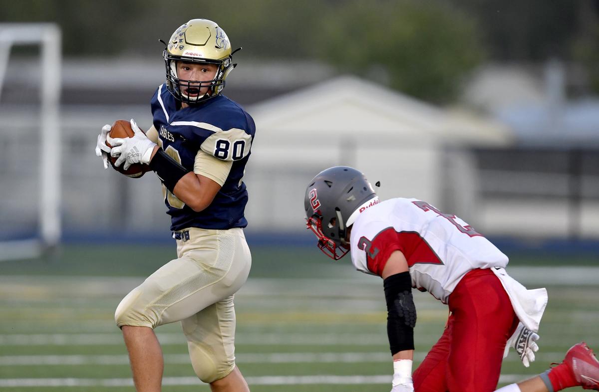 Bald Eagle Area’s Kyler Cunningham makes a catch and tries to cut around a Central defender during the game on Friday, Spet. 20, 2019.