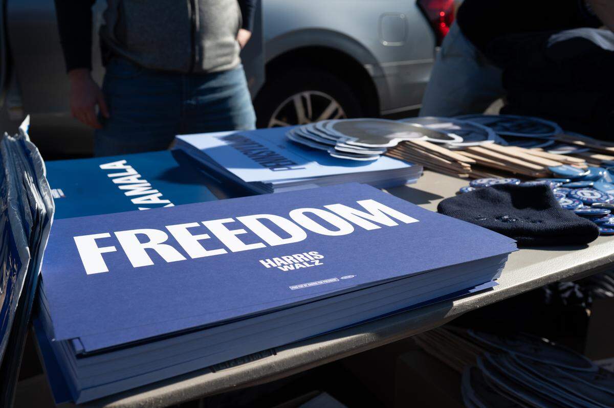 Promotional material for the Harris Campaign sits on a table during the Blue Wall Bus Tour on Sunday, Oct. 20, 2024.