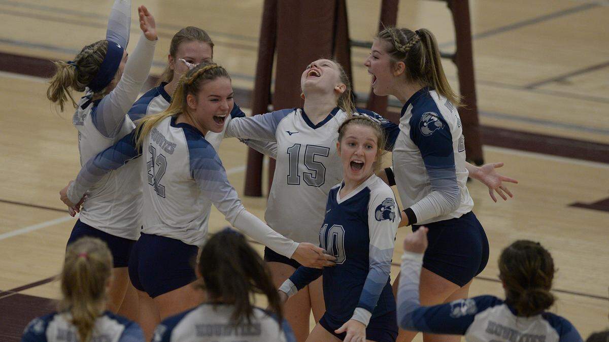 Philipsburg-Osceola’s Kalista Butler (15) and her teammates celebrate their District 6 AA championship defeating Central Cambria in three straight sets Saturday, Nov. 6, 2021 at the Altoona Area High School Fieldhouse.