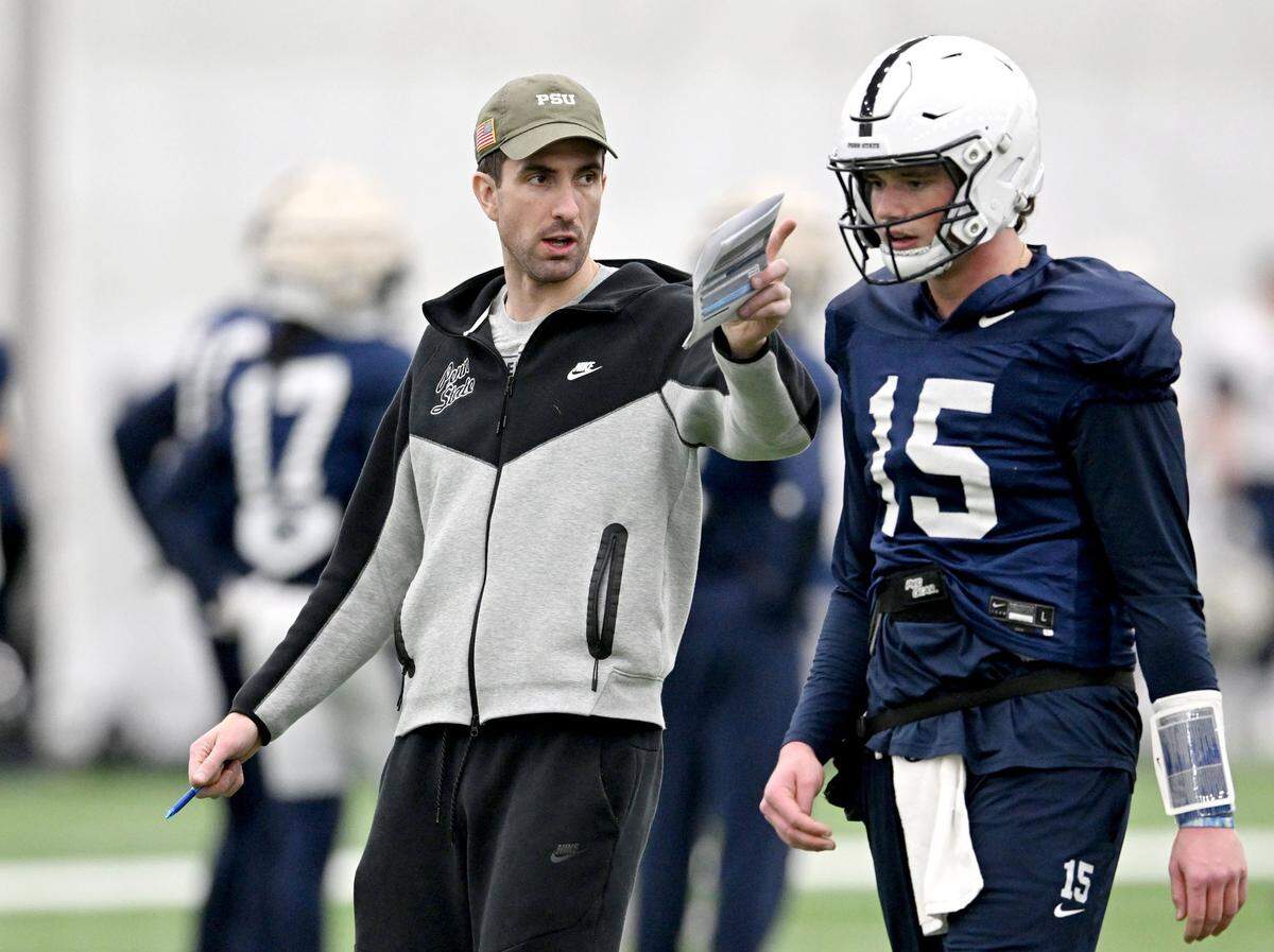 Penn State quarterbacks coach Danny O’Brien talks to Drew Allar during practice on Friday, Dec. 27, 2024 at Holuba Hall as the team prepares for the Fiesta Bowl.