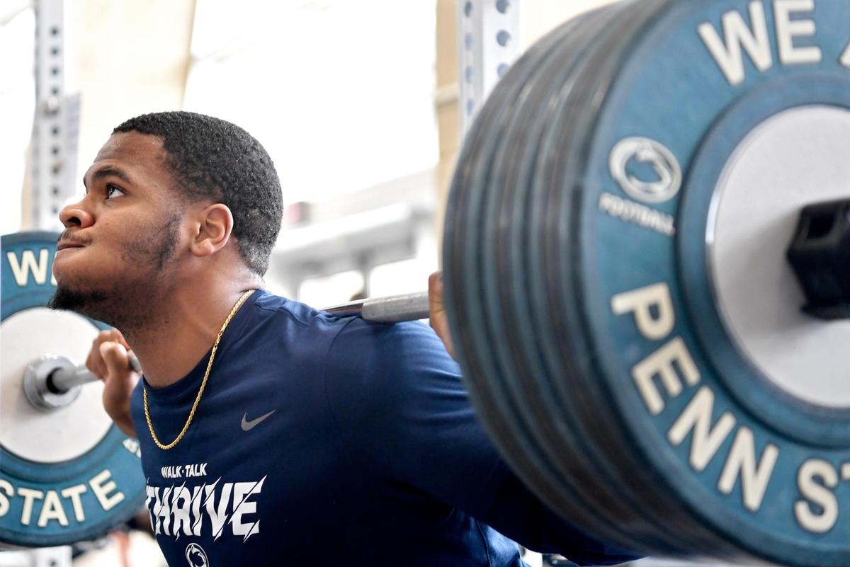 Penn State linebacker Micah Parsons squats during a weightlifting session on Wednesday, March 4, 2020.