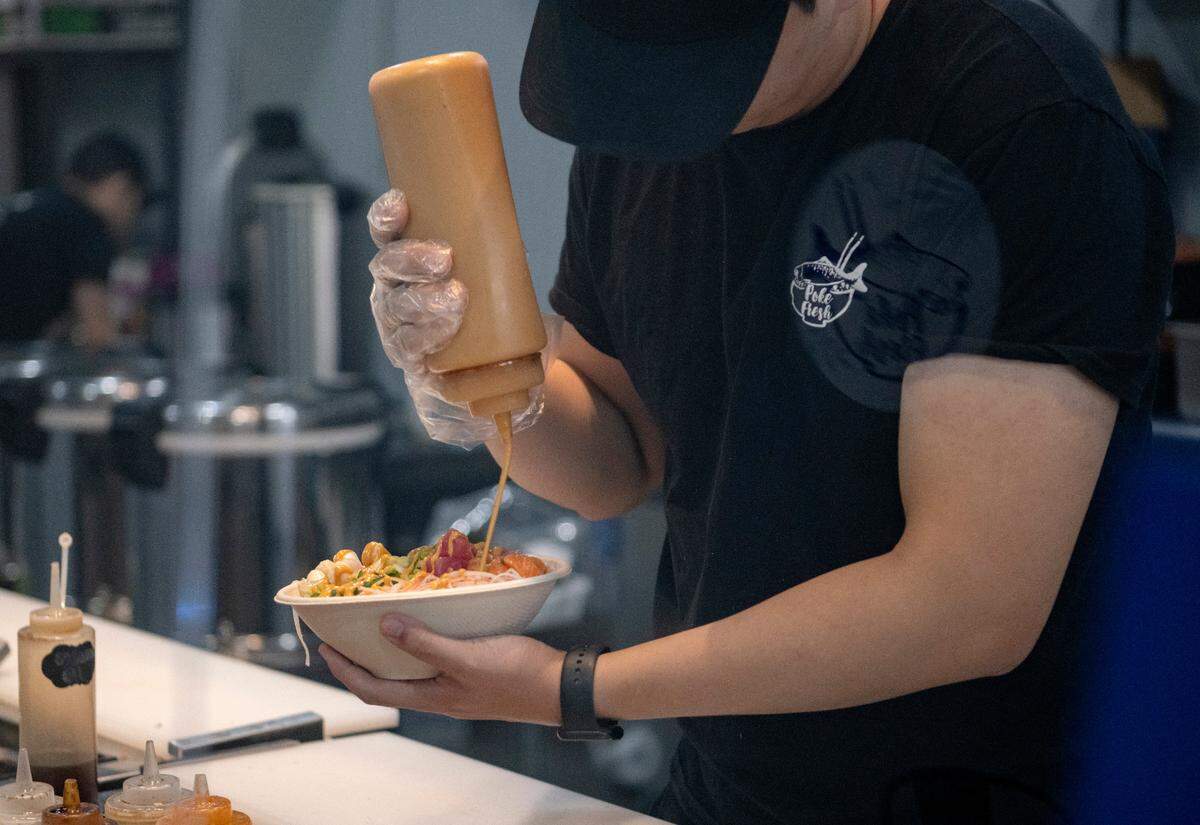 A Poke Fresh Special is made at the new Poke Fresh on East Calder Way.