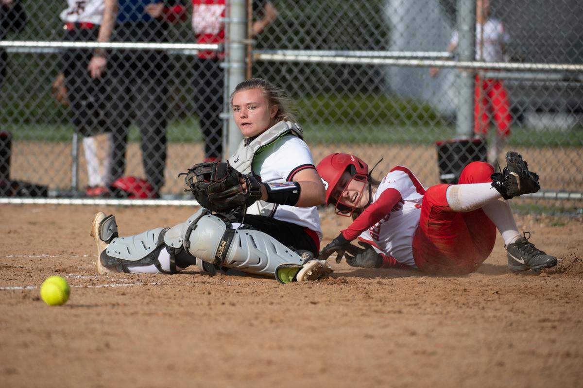 Bellefonte’s Tori Reichert runs through the catcher to score a run during a high school softball game between Bellefonte and Clearfield on Thursday, May 6, 2021 in Bellefonte, Pa.