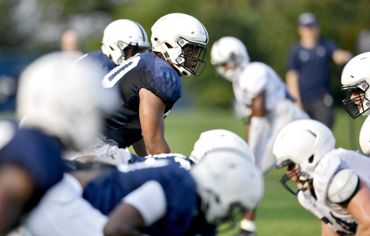 Penn State linebacker Jesse Luketa lines up for a play during practice on Wednesday.