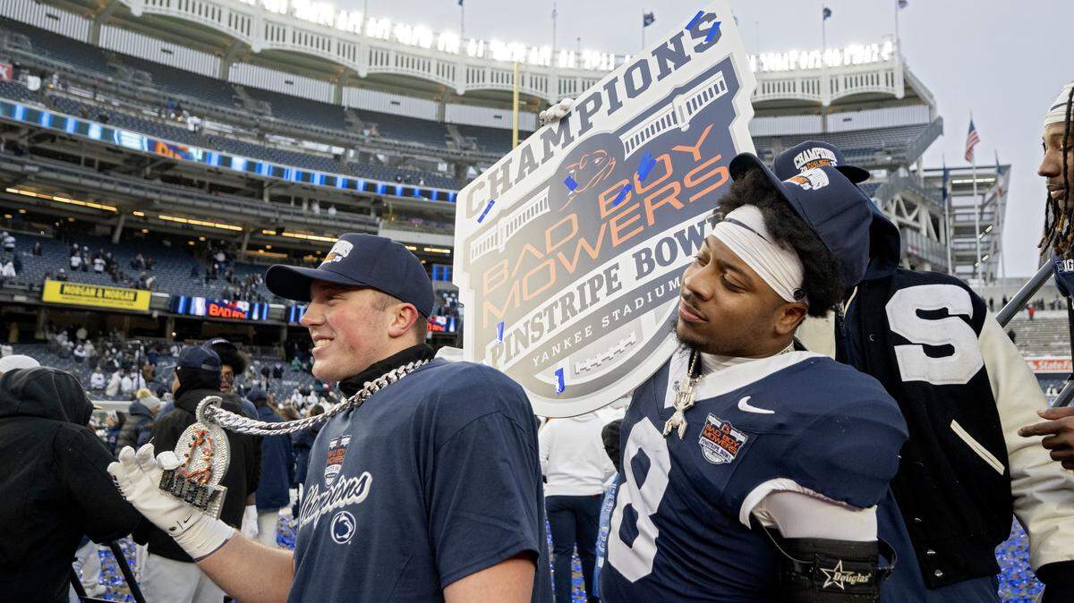 Penn State linebacker DaKaari Nelson holds up a champions sign after the win over Clemson in the Pinstripe Bowl at Yankee Stadium on Saturday, Dec. 27, 2025.