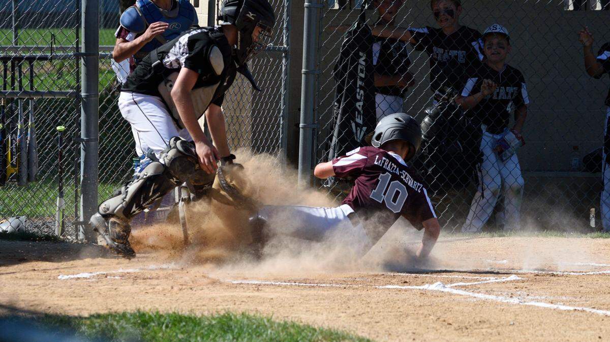 State College’s Vincent LaFrazza-Schwartz steals home to score against Indiana on Saturday in the opening game of the Section 4 Majors Little League All-Star tournament in Mechanicsburg. Last week, the State College-Bellefonte all-star game was postponed because of an umpire shortage.