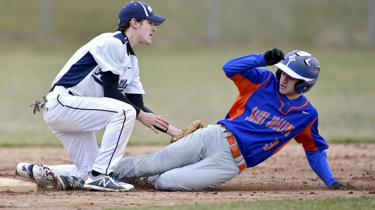 Penns Valley’s Calvin Russell tags out Saint Joseph’s Zane Thornburg when he tries to steal second during the game on Friday, April 6, 2018 at Governor’s Park.