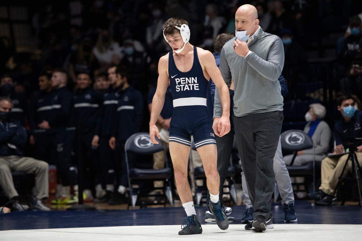 Penn State head coach Cael Sanderson speaks to Penn State’s Drew Hildebrandt during a wrestling dual between Penn State and Rutgers on Jan. 16 at Rec Hall.
