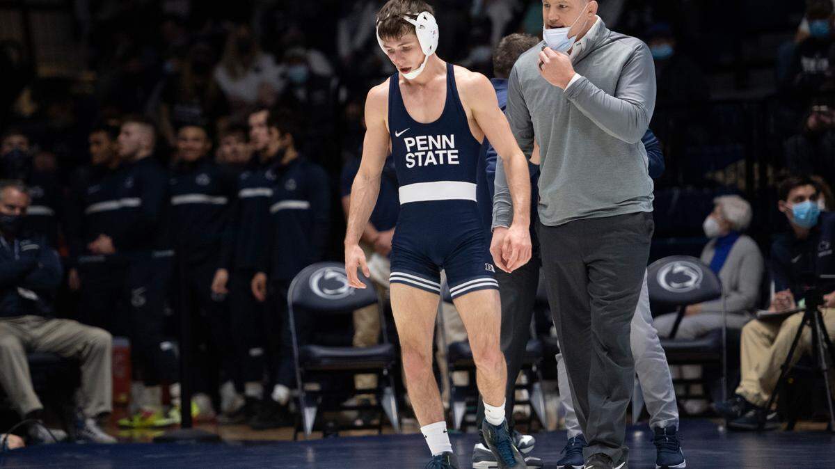Penn State head coach Cael Sanderson speaks to Penn State’s Drew Hildebrandt during a wrestling dual between Penn State and Rutgers on Sunday, Jan. 16, 2022 at Rec Hall in University Park, Pa. Penn State defeated the Scarlet Knights 27-11.