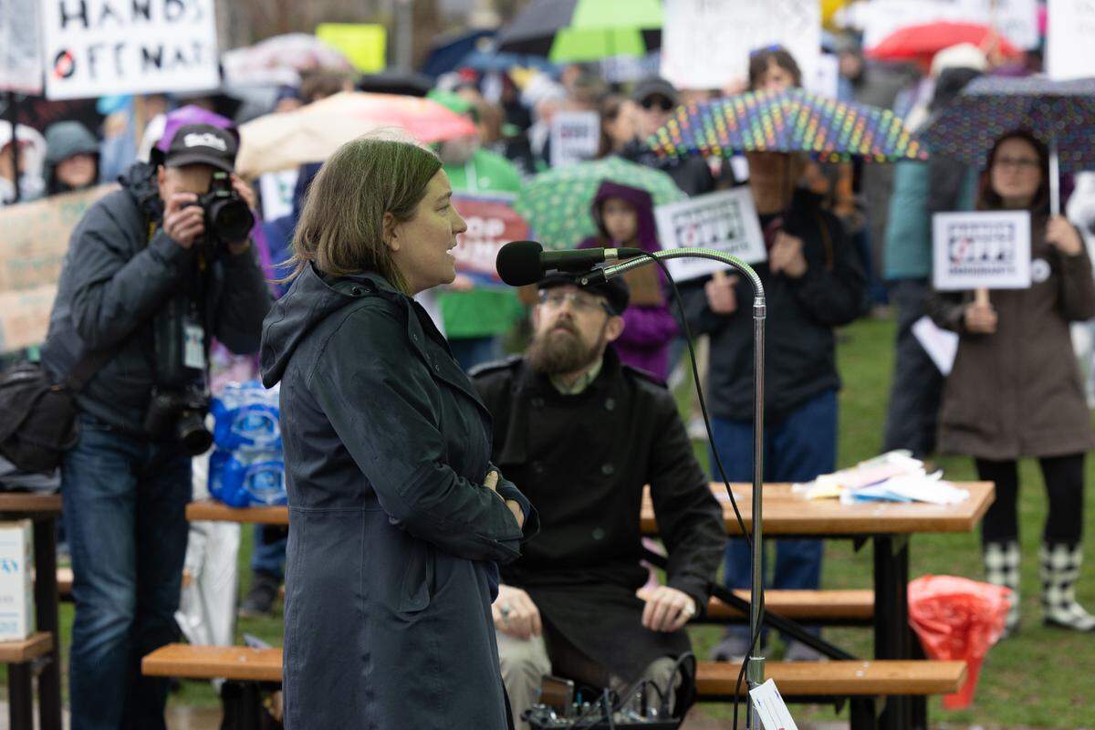 Christy Delafield, a humanitarian aid worker who lives in Boalsburg, speaks during the “Hands Off!” rally at State College’s Sidney Friedman Park, in opposition of President Donald Trump. The event was part of a nationwide effort that saw more than 1,000 similar rallies held across all 50 states.