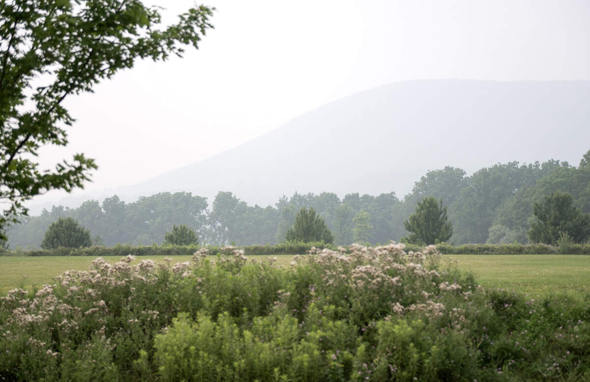 Mount Nittany can barely be seen through the smokey skies from Oak Hall Regional Park on Thursday, July 16, 2026. Wildfire smoke from Canada  and Minnesota caused unhealthy air levels in Centre County on Thursday, July 16, 2026.
